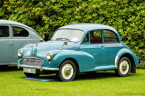 Ronneby, Sweden - June 28, 2014: Nostalgia Festival with classic cars and motorcycles as main attractions. Green Morris minor 1000 1960.