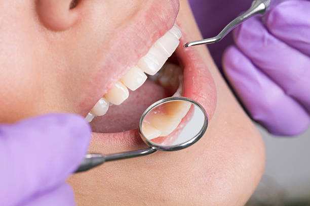 istock Dentist working on girls teeth 500692128