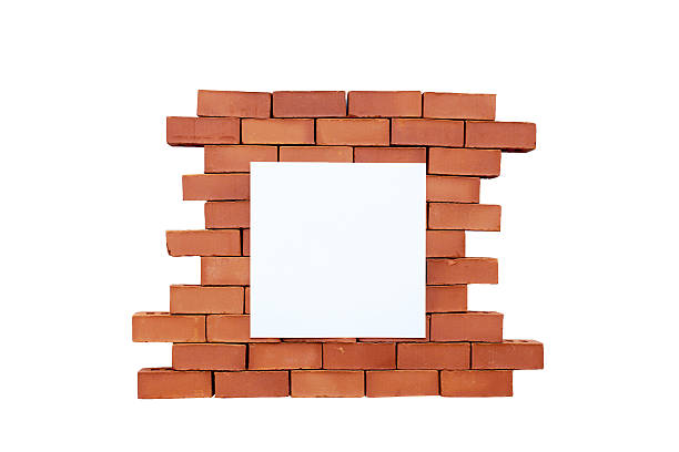 istock brick wall with a blank sheet of paper 500692404