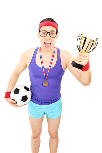 istock Nerdy football player holding a trophy 500693044