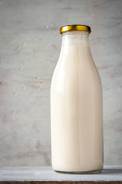 istock Natural yogurt in the glass bottle vertical 500694228