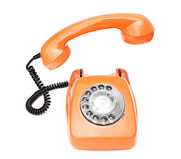 istock Orange retro telephone isolated on white background. 500696978