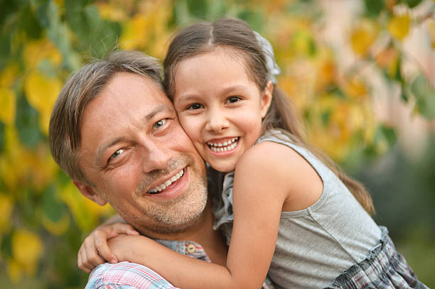 istock father with daughter in summer park 500697068