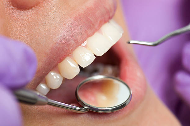 istock Dentist working on girls teeth 500699278