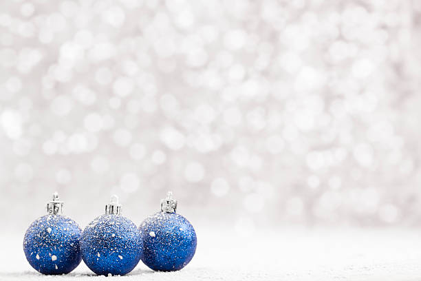 istock Christmas ball in the snow on blurred light background. 500699616