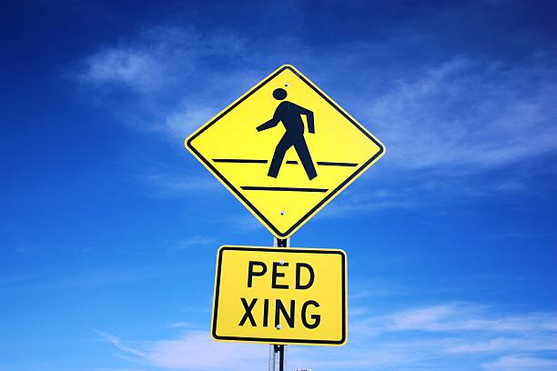 Pedestrian crossing PED XING stock photo