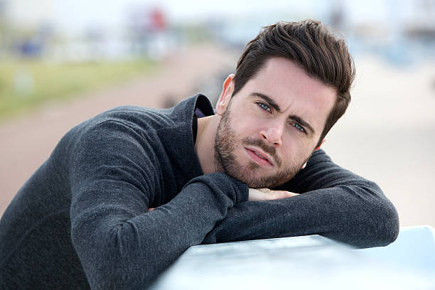 istock Serious young man posing outdoors 500702787
