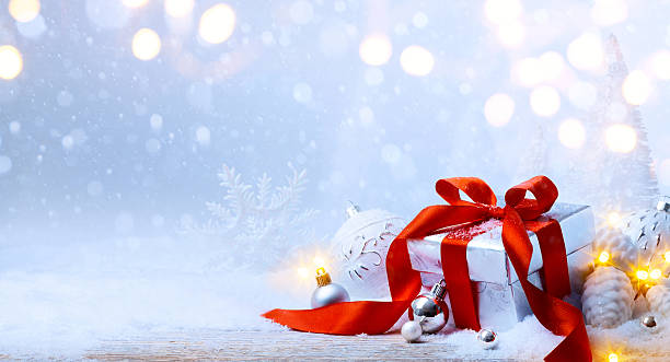 istock art Christmas balls and gift box on snow 500703038