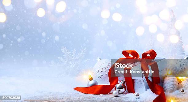 Art Christmas Balls And Gift Box On Snow Stock Photo - Download Image Now - Bag, Christmas, Christmas Tree