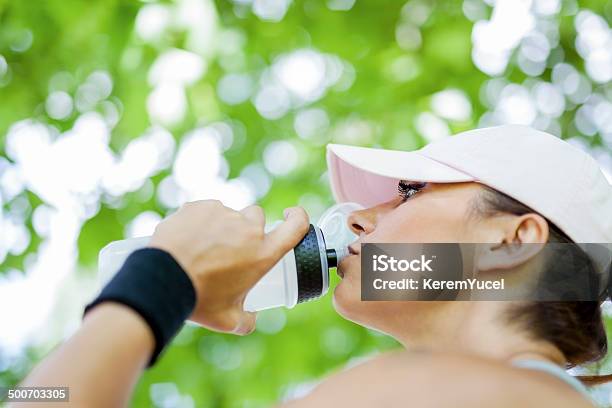 Thirsty Young Woman Drinking Water While Resting Stock Photo - Download Image Now - Activity, Adult, Adults Only