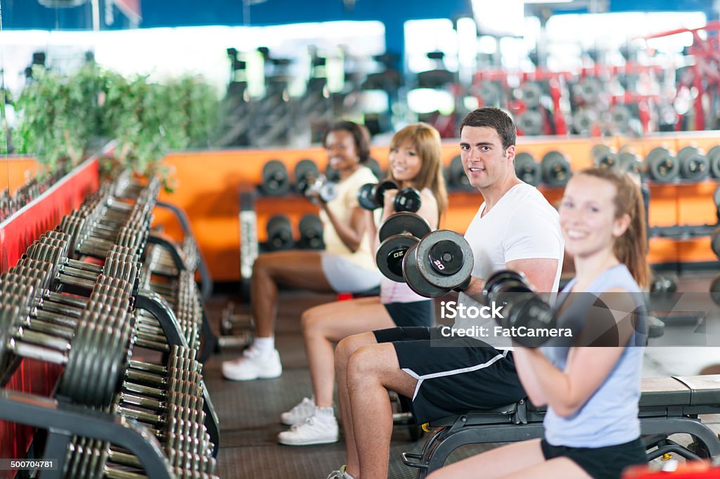 Exercising in gym Diverse group of people in gym doing exercise 20-29 Years Stock Photo