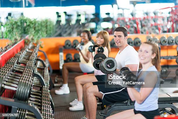 Exercising In Gym Stock Photo - Download Image Now - 20-29 Years, 40-49 Years, Active Lifestyle