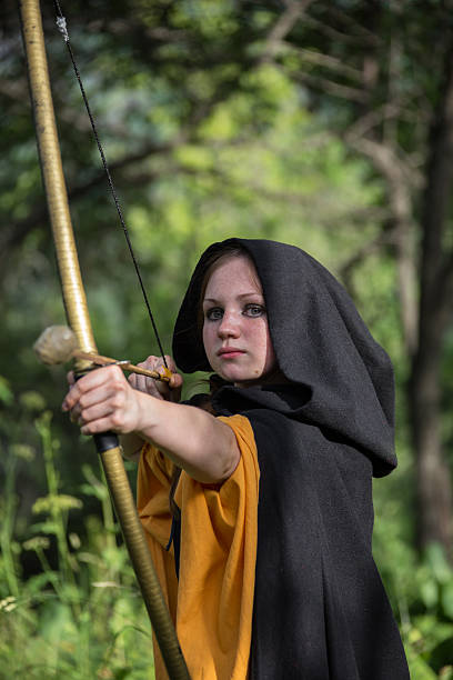 istock Beautiful woman drawing a bow 500705046