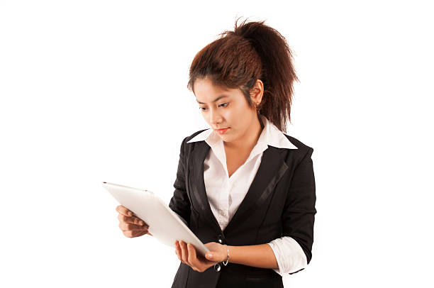 Business woman checking her tablet stock photo