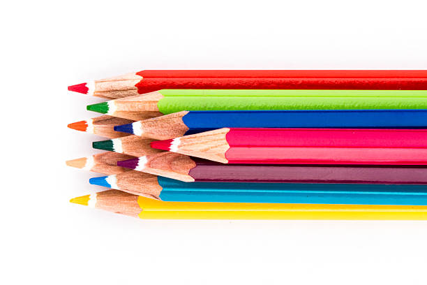 different colored pencils on white background stock photo