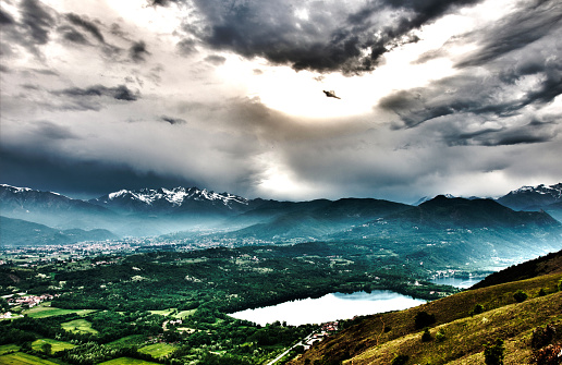 Lakes of Avigliana: creative interpretation, beautiful cloudy sky and mountains