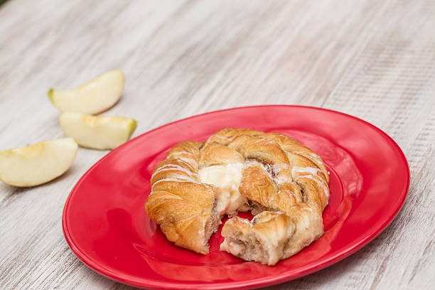 Danish Pastry Baked Good and Apple stock photo