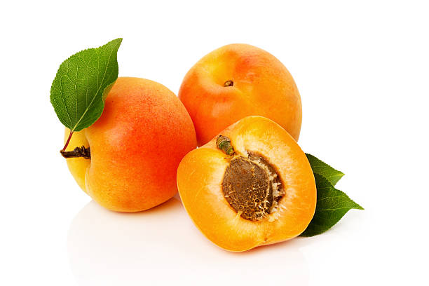 istock Fresh apricots with leaves isolated on white background 500707597
