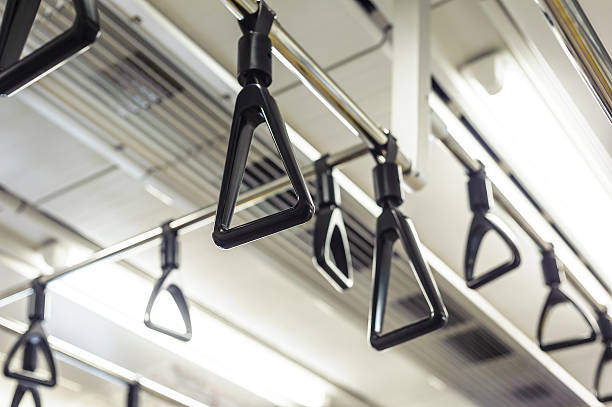 Hanging straps Hachioji,Tokyo,Japan-April 25, 2010 train air conditioner stock pictures, royalty-free photos & images