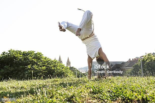 Capoeira Woman Awesome Stunts In The Outdoors Stock Photo - Download Image Now - Capoeira, Activity, Adult