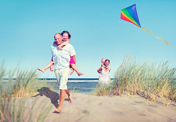 istock Cheerful Family Playing by the Beach 500720851