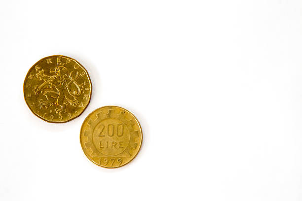 Two obsolete golden coins, Czech and Italian