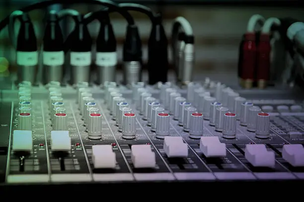 Photo of Sound mixer control panel, close-up of audio controls