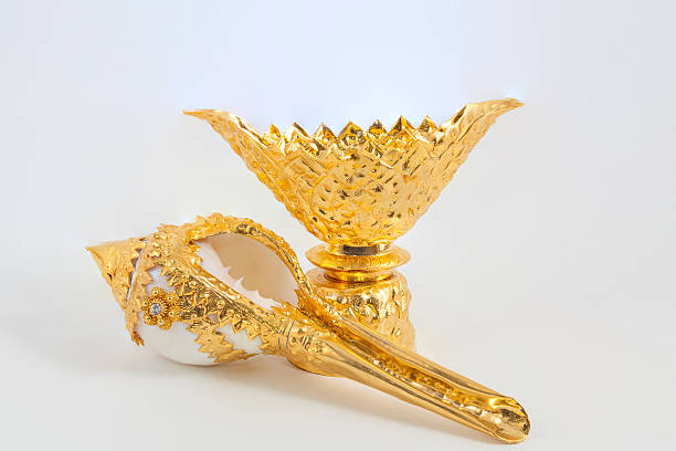 istock Conch shell on golden tray for blessed water 500725933