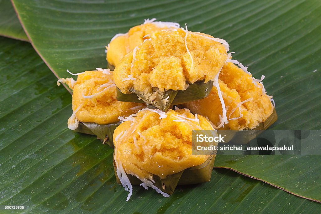 Thai Traditional Dessert Toddy Palm Cake with Coconut in Banana Leaf Container. Appetizer Stock Photo