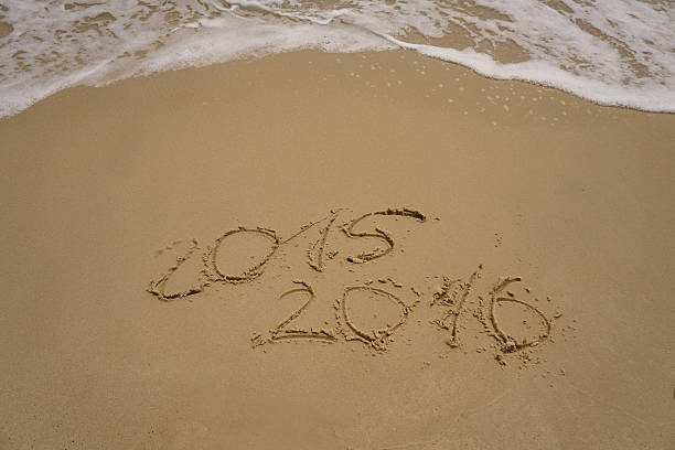 istock 2015 and 2016 year on the sand beach 500727942