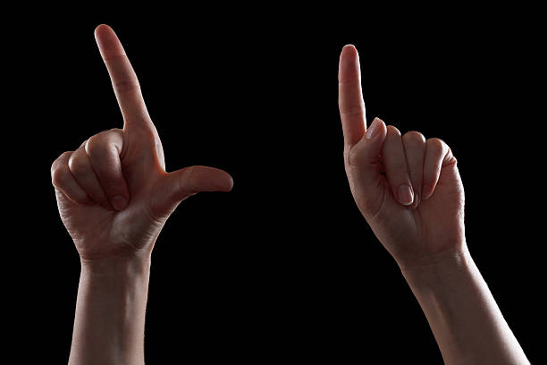 istock Gesture, young woman's hand indicates the direction or touch devices 500728744