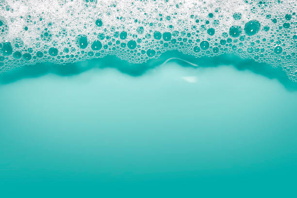 液体石鹸の泡の背景（ブルー） - soap sud bubble textured water ストックフォトと画像