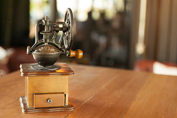 istock Old wooden coffee grinder with handle in shop background design 500732490