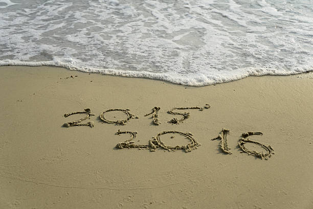 istock 2015 and 2016 year on the sand beach 500732534