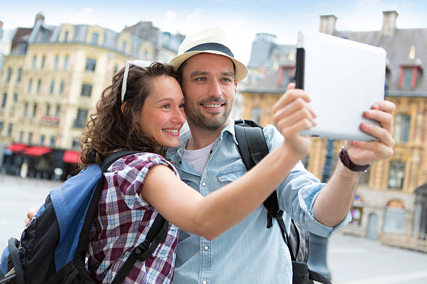 istock Young couple on holidays taking selfie 500733477