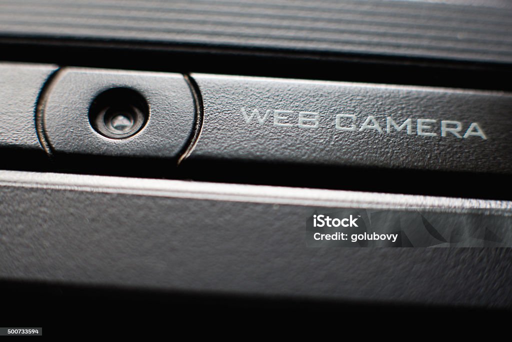 Web camera close up on laptop Web camera close up on black laptop monitor. Spy camera (phishing, hack) concept Home Video Camera Stock Photo