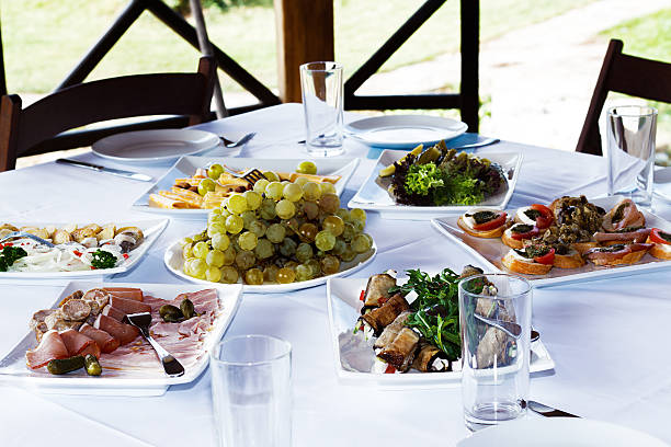 istock snacks and meals on the table with a white tablecloth 500733760