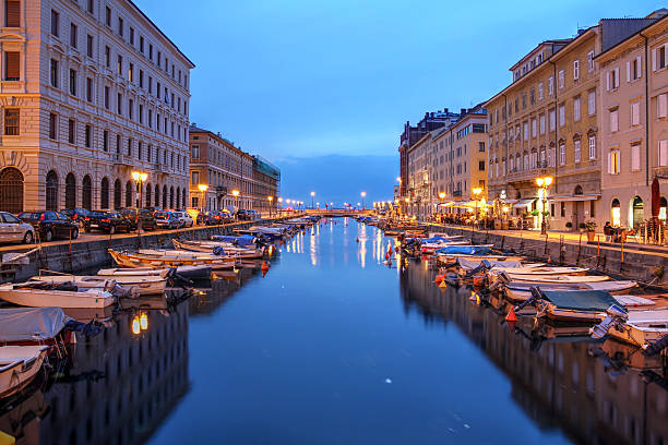 Trieste, Italy Scenic view of the Canal Grande in Trieste, Italy at night. trieste stock pictures, royalty-free photos & images