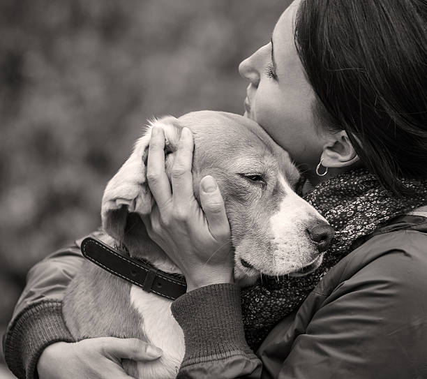 istock Woman with her dog tender hugs 500734612