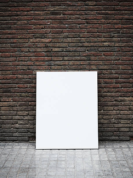 istock Grungy wall and blank poster 500734789