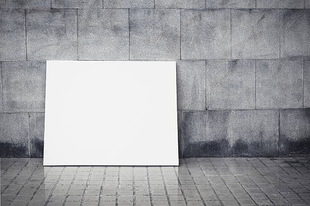 istock Grungy wall and blank poster 500734795