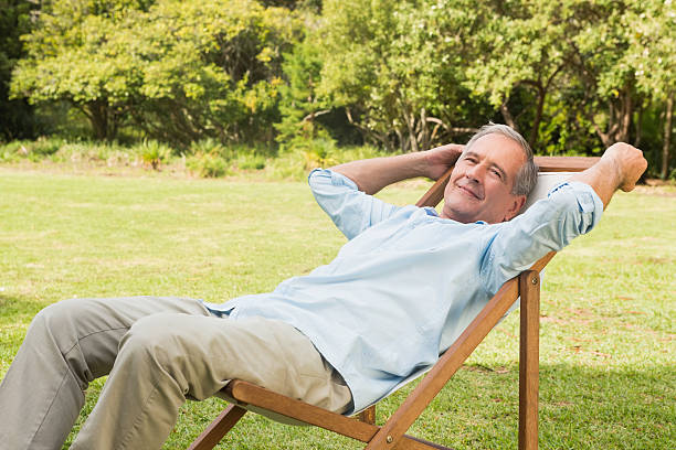 istock Happy mature man sitting on sun lounger 500735261