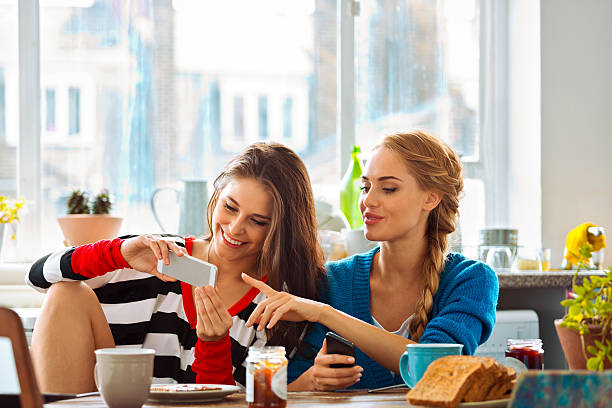 istock Girls using smart phones 500735979