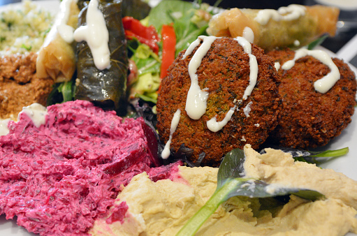 Mediterranean salads and falafel served on plate. closeup