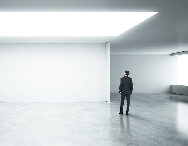 istock Young businessman standing in bright office 500741145