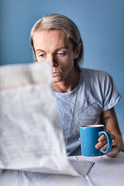 istock Man Reading The Morning Paper At Table 500744770