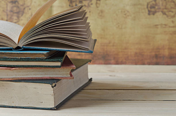 istock stack of books on wooden table 500744776