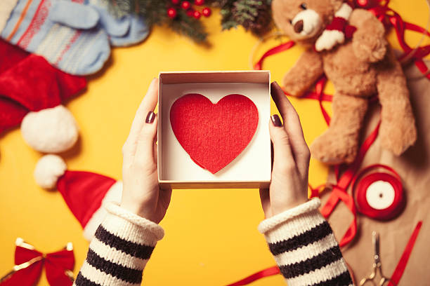 istock Woman wrapping a heart shape toy 500745006