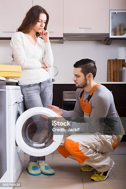 Housewife Showing Broken Washing Machine Stock Photo - Download Image Now - Repairing, Adult, Appliance