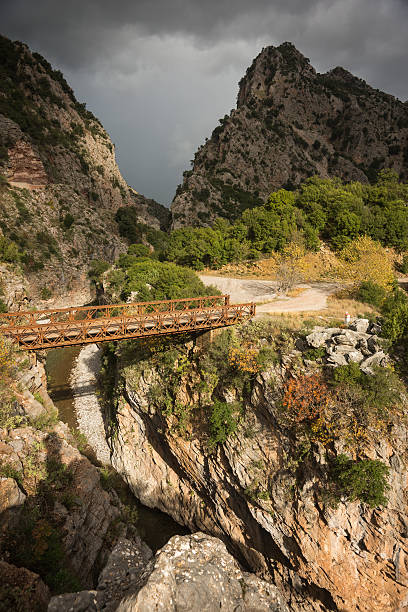 istock Scenic mountain autumn landscape with river and bridge 500745966